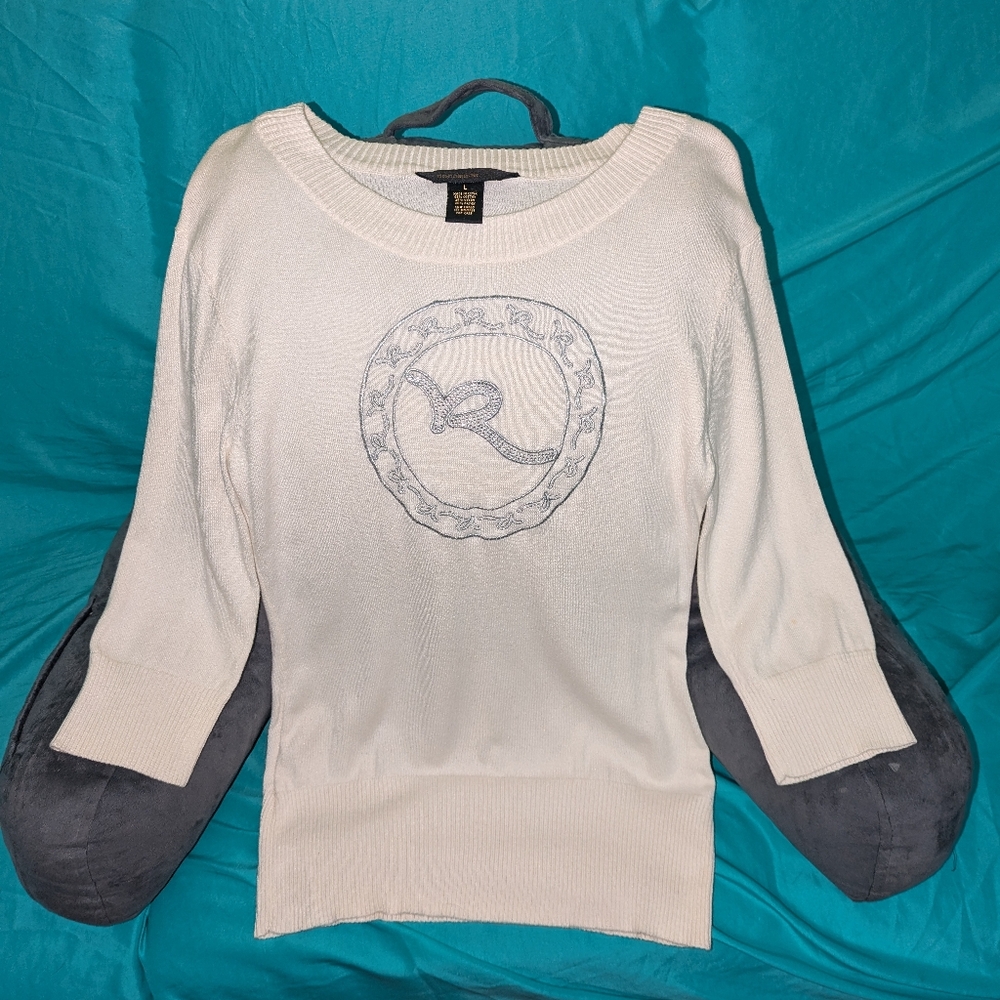Rocawear white sweater medium with silver gem-like accents on the R